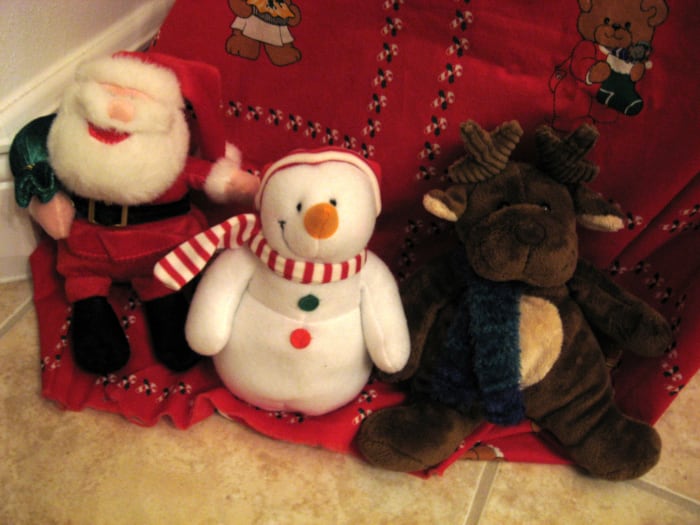 Fabric covers the tree base and the box that it sits on. Then I surround it with stuffed animals.