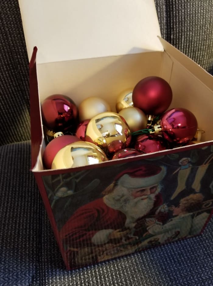 When I decorate, this storage box goes underneath the tree so it looks like we have more presents (only 2 of us). After the holiday, this one goes in my closet. My garage gets hot enough to damage the finish on the Christmas balls.