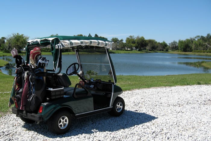It's not a requirement, but you have a head start if your cart is green. We can take off the golf clubs and then attach any decorations we like and presto, instant St Patrick's Day parade entry.