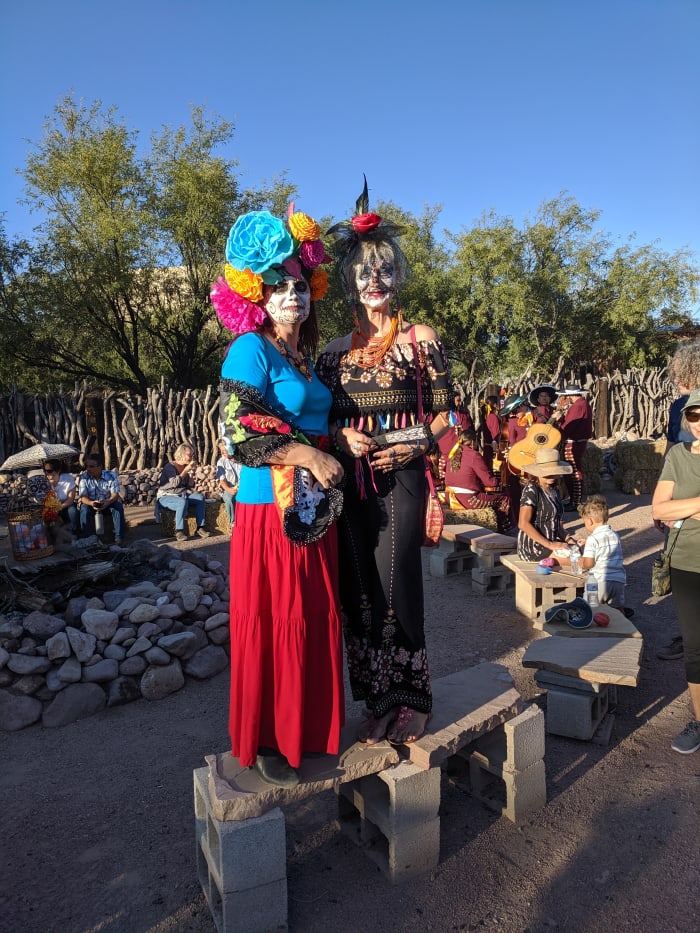 My wife posing with another woman in costume at end of the All Souls' Day Parade in Tubac, AZ
