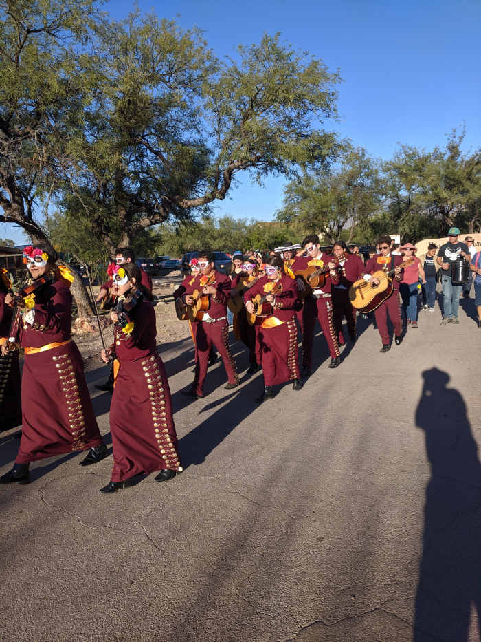 The Nogales High School band marching in the Tubac All Souls' Day/el Dia de los Muertos festival