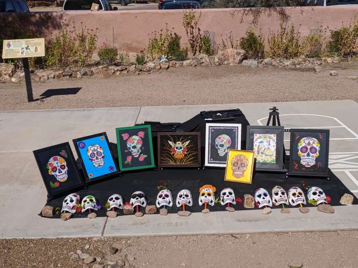 El Dia de Los Muertos masks and pictures on display in Presidio State Park in Tubac, AZ