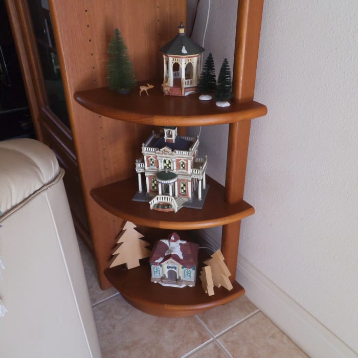 Some people set up a whole village scene with miniature houses at Christmas. I only have a few pieces so I display them this way.