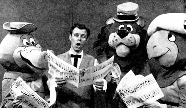 Wally Gator, Lippy the Lion, and Touche Turtle gathered around Portland television entertainer Ramblin' Rod Anders