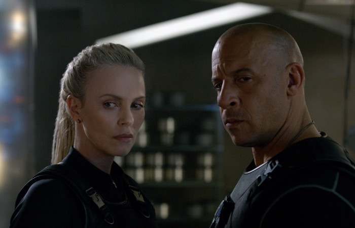Theron (left) is an intriguing addition to the cast but her motives and ultimate goal remain elusive, undermining her baddie credentials.