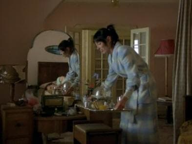 One scene is filmed with the camera looking through a mirror at the actors. This is probably symbolic of Jack's loosening grip on reality, and two worlds intersecting, the world of the past/ghosts and the world of the present.