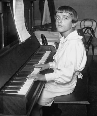 A photo of Nino Rota aged about 12 years of age playing the piano.