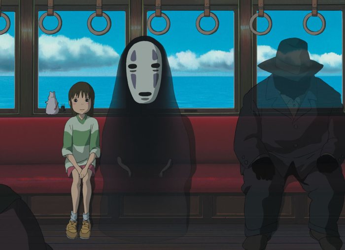 The character of No Face (centre) demonstrates the film's ability to be child-like, enigmatic and genuinely terrifying in equal measures
