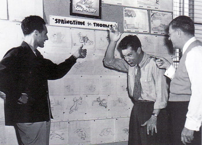 Joseph Barbera (left) and William Hanna (center) going through a Tom & Jerry storyboard with Fred Quimby (right)