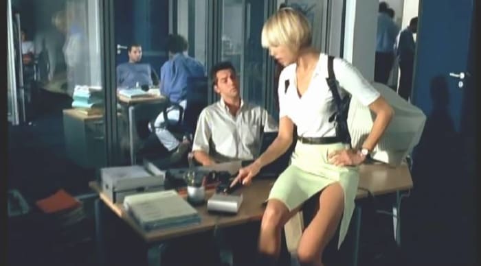 The film is one of the most sexist movies I've ever seen - check out how this "detective" is dressed at the station!