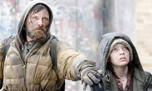 Mortensen (left) and Smit-McPhee (right) carry the film with performances that bring the film's apocalyptic tone worryingly to life.
