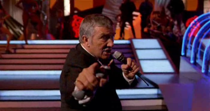 Dawson is exceptional as the slimy, attention-craving host of the show - a role that parodied his earlier role as host of game-show 'Family Feud'.