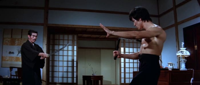 Lee (right) dominates the picture with his magnetic charisma, despite the suspect dubbing. He is undoubtedly the film's star.