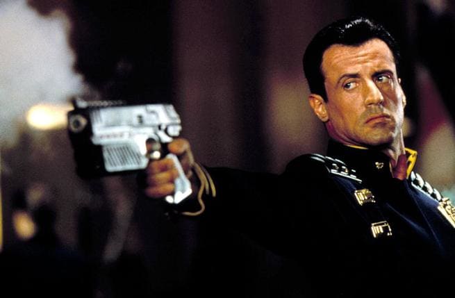 Stallone may be unfairly maligned for the decision to ditch the character's helmet but he does well as the muscle-bound law-enforcing anti-hero. He looks the part.