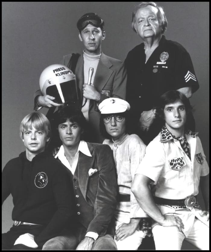 A cast publicity photo of The Kids From C.A.P.E.R. Top Row: Left to right:Robert Lussier and Robert Emhardt Bottom Row:Left to right: Biff Warren, John Lansing, Cosie Costa and Steve Bonino