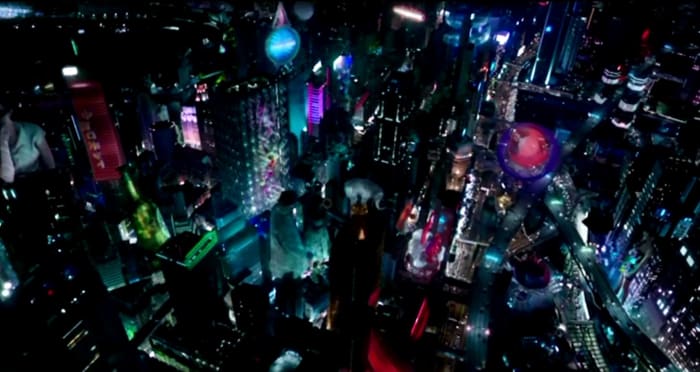 Ghost in the Shell is set in a futuristic city, filled with vibrant lights and holographic advertisements.