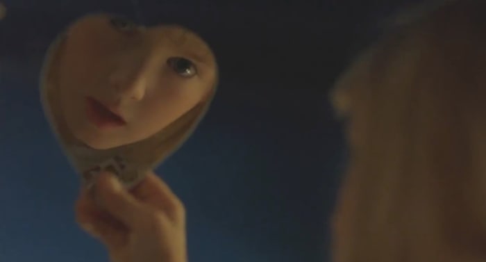 Because after literally just establishing that she knows nothing about Candyman, it only makes sense that she starts chanting his name in a mirror... Piss off!