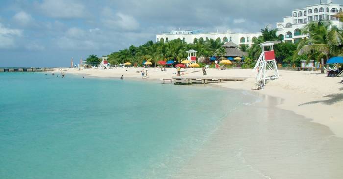 The pure Doctor's Cave beach sits in Montego Bay where most visitors to Jamaica find accommodations.