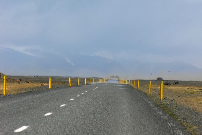 What appears to be water on the road ahead is merely a mirage.