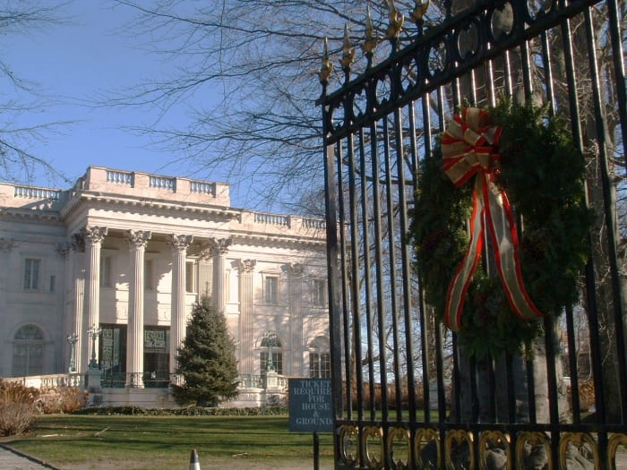 Front entrance gate of The Marble House decorated with a giant Christmas wreath.