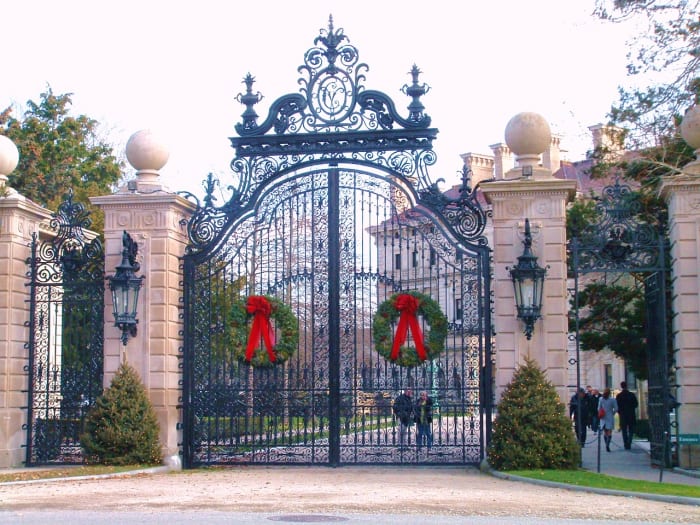 Breakers' main entrance has a 30 foot wrought iron gateway topped with elaborate scroll-work including the acorn and oak leaf family symbol, surrounding the initials of Cornelius Vanderbilt II.