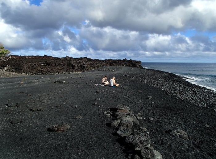 Looking north from the new beach toward where the lava flow solidified and formed a massive wall. Behind it is an endless lava field!