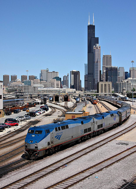 In a quintessential Chicago shot, Amtrak #49, the Lake Shore Limited, backs in to Union Station. Note the 261 cars on the tail of Amtrak #7 just above the second loco in the consist.
