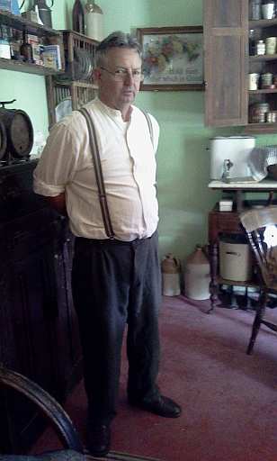 Andrew has a story for every artifact at The Tin Shed. Here he is in the 1930s cottage.