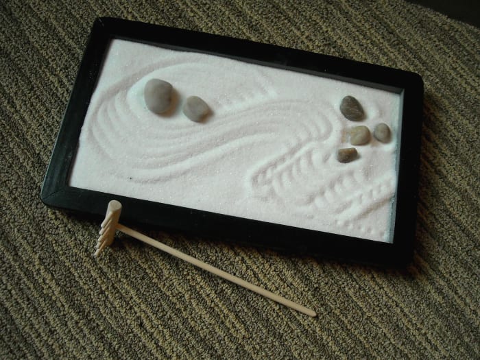 The Zen Garden. If you need to meditate, or if you have nothing better to do, you can move the rocks, rake the sand and ponder the meaning of life.