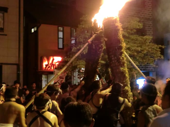 Let's get a closer look. Here, the first two torches are leaned up against each other.