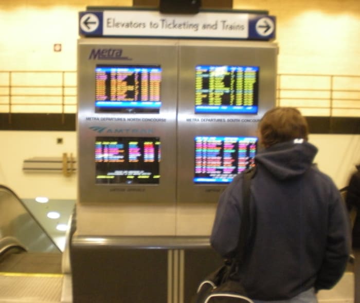 Amtrak and Metra Arrival/Departure information screens at Union Station's Canal Street entrance.