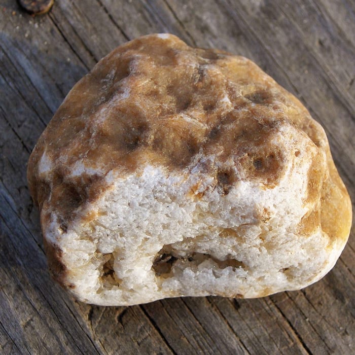 This is a piece of coral of some kind, but what makes it so special is there are crystals in side where the white surface looks to have a dark spot.