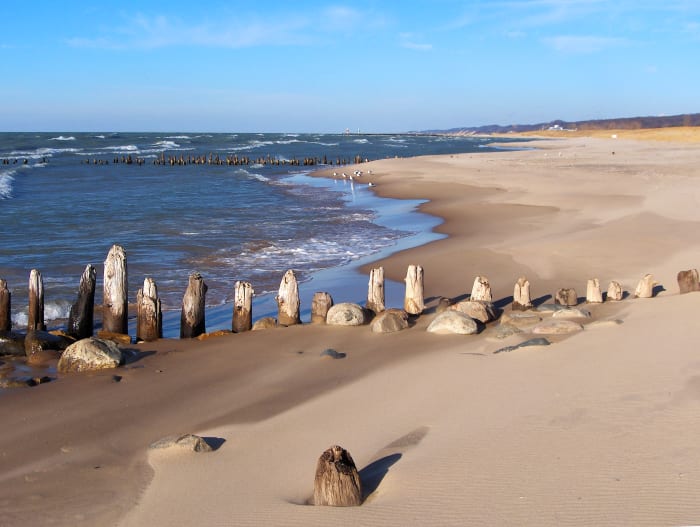 View from Oval Beach showing former Kalamazoo River mouth between the two rows of abandoned pier pilings. ENLARGE to see new channel in the background with two pier heads. November, 2012 Showing drop in water levels from year before