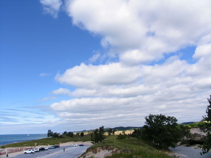 Today, standing on top of the 40 foot dune built up by westerly winds between the forward parking lot and overflow lot at Oval Beach.