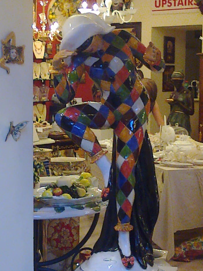 The mischievous Harlequin, one of the stock characters from the Commedia dell'arte, in full-size porcelain
