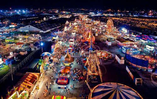 Wow. This may seem like a fantastic amusement park, but it is actually a traveling carnival that will stay on site no more than two weeks before moving to another town. Many foggy childhood memories of amusement parks have turned out to be carnivals.
