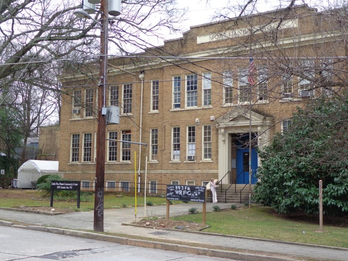 Austin Ave Community Center frontage, showing old Moreland Elementary sign. The canopy visible at left is the eastern entry to the Horizon. Photo by author.