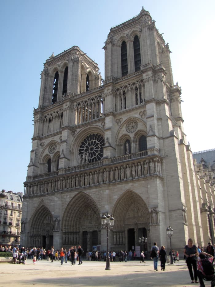Notre Dame from the front: the three portals, gallery of the kings, exterior of the west rose window and the twin towers.