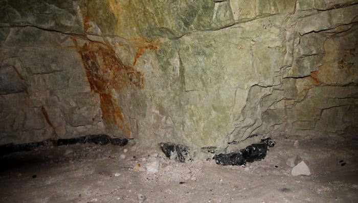 One of the old mines showing the dark band of flint - a precious commodity in the Stone Age. One can descend via a ladder to see the Neolithic stone workings