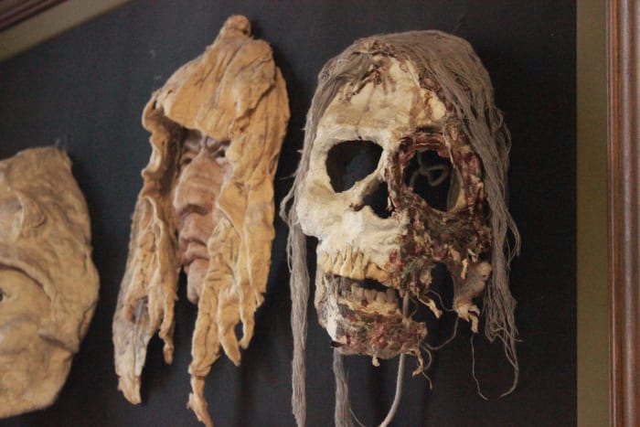 Masks made by an inmate of the Penitentiary; they hang near the ticket counter at the museum.