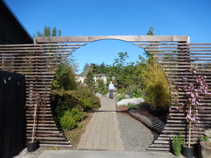 The enticing entrance to garden seating at the Backdoor Kitchen, a popular upscale restaurant in Friday Harbor that welcomes diners and their pets.