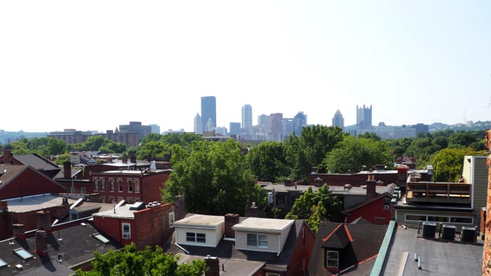 It can get hazy, hot and humid in the summer. The view of downtown from the stairwell of a museum in the Mexican War Streets area of Pittsburgh, PA.