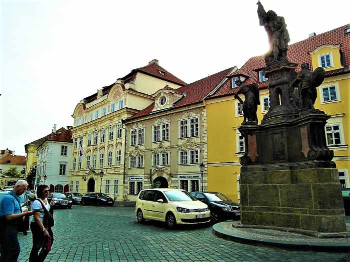 Statue of John the Baptist in the foreground. Turba Palace can be seen behind on Maltese Square.