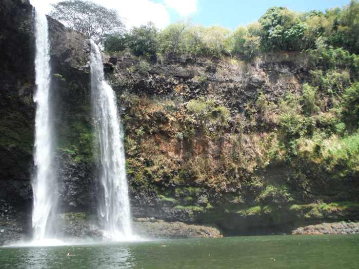 Venture to Wailua Falls on Kauai and feel the freedom of dipping your toes into the water and listening to the rushing waterfall.