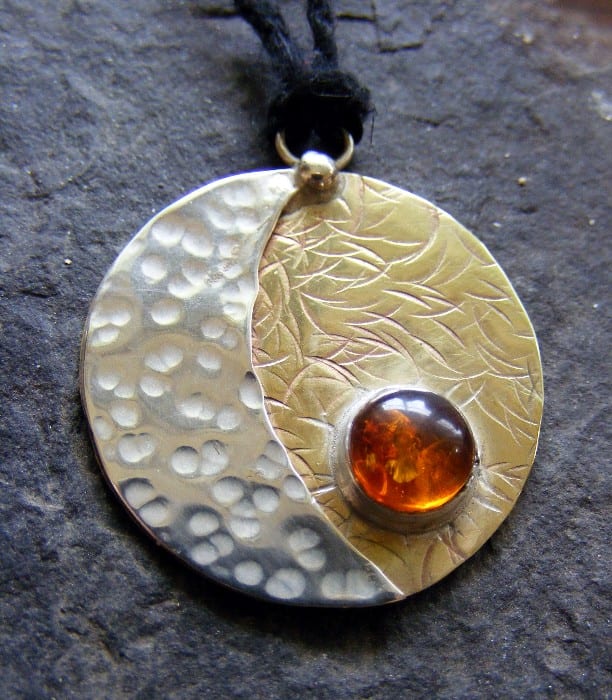 Beautiful Sun-Moon pendant with amber. Amber and gold connect with the energy of the Sun, while silver keeps in touch with the Moon energy.