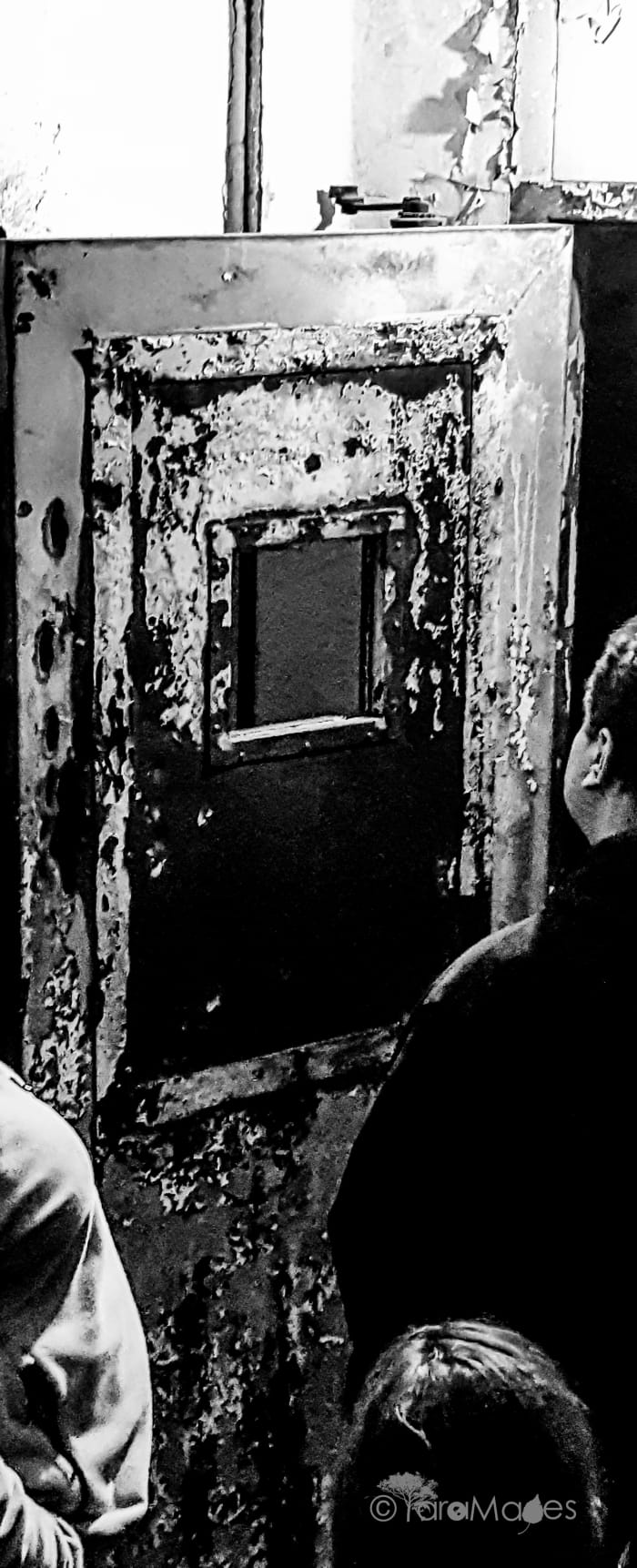 Fourth Floor Door's hatchet marks by alleged trespassers held captive by the shadow people of Waverly Hills Sanatorium