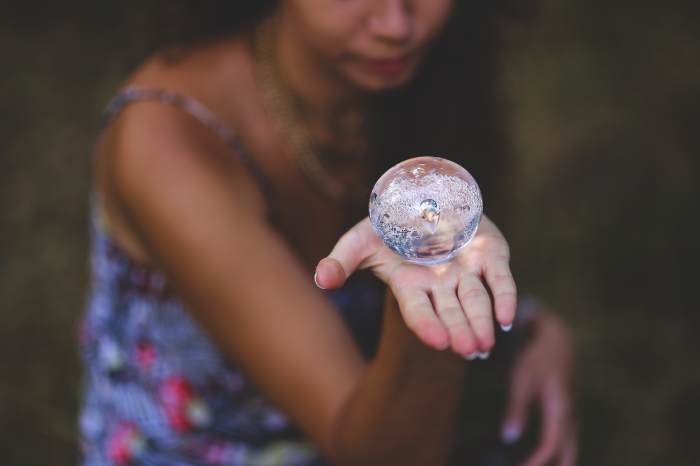 Some psychics are able to intuit meaning from divinatory tools, such as tarot cards, playing cards, and a glass or crystal ball.