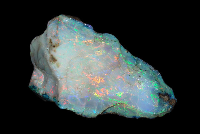 A raw piece of opal crystal. Raw or tumblestones are both effective in healing.