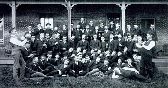 A group of German Wallace students in 1892 in front of today's present day Kohler hall. Originally called the German Methodist Orphan Asylum was sold to German Wallace College in 1867. Image first published in 1892. Public domain.