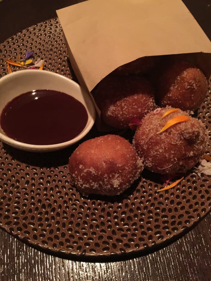 Warm Donuts with Lingonberry Jam and Dark Roast Ganache. Wonderful dessert at Artist Point. Trust me!